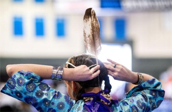 Colleen Graves adjusts her regalia before the start of the 23rd "Celebrating All Walks of Life" Pow Wow April 13.