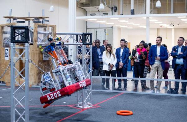 Onlookers observe robot created by Hopkins High School students.