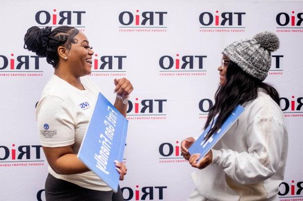 first-generation students Cierra Hatcher, left, and Talaya Smith laugh together during a first-generation student celebration at the Cook-DeWitt Center